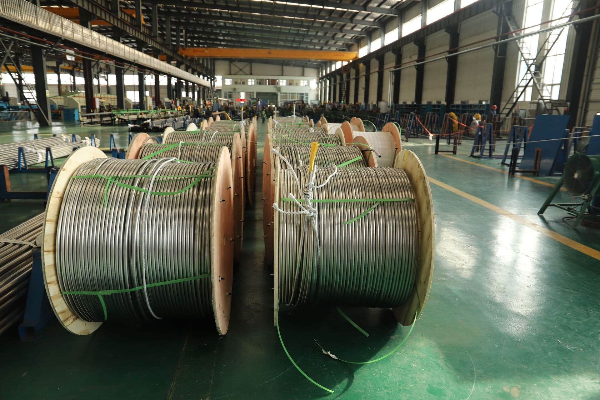 Wooden reels of cable on a plant floor